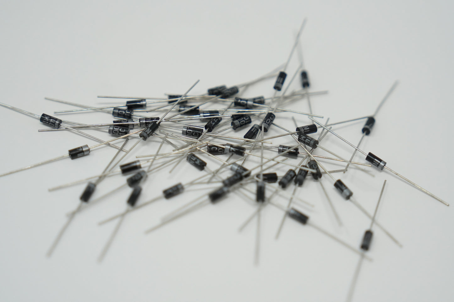 Pile of electronic diodes on a white background